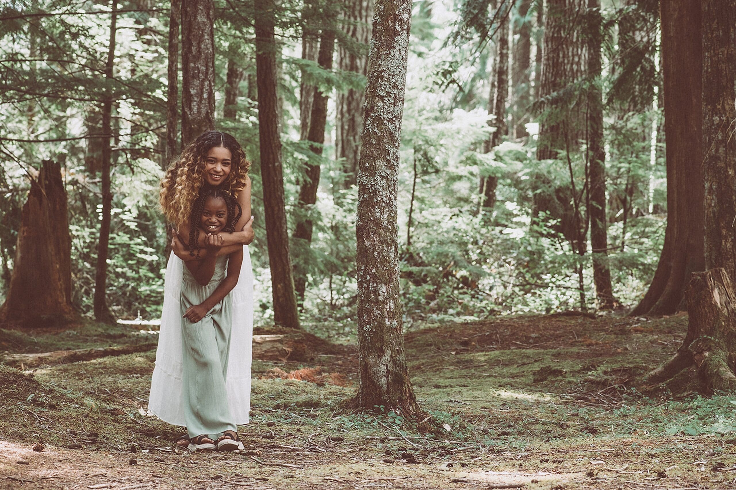 Mother and daughter in a park setting enjoying each other